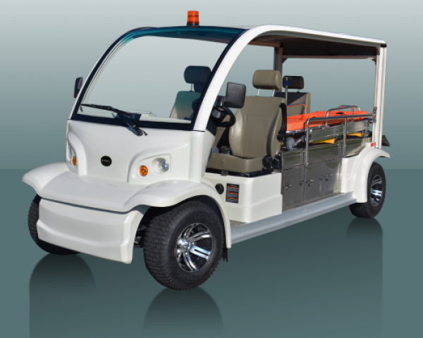 A white Star electric emergency vehicle that is stationed in front of an aqua blue backdrop.