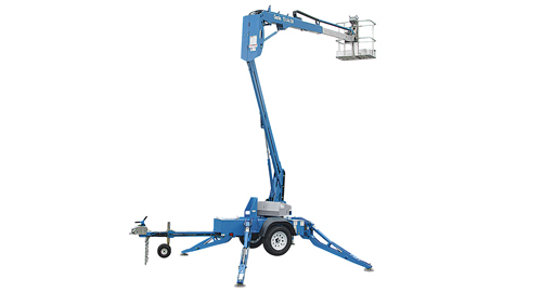 A large blue crane lift is stationed fully-extended in front of a white backdrop.